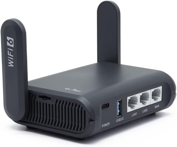 Image of the GL.iNet GL-AXT1800 (Slate AX) travel router, a compact Wi-Fi 6 device featuring dual external antennas, three Ethernet ports (1 WAN and 2 LAN), a USB 3.0 port, and a sleek, portable design suitable for travel and remote connectivity.