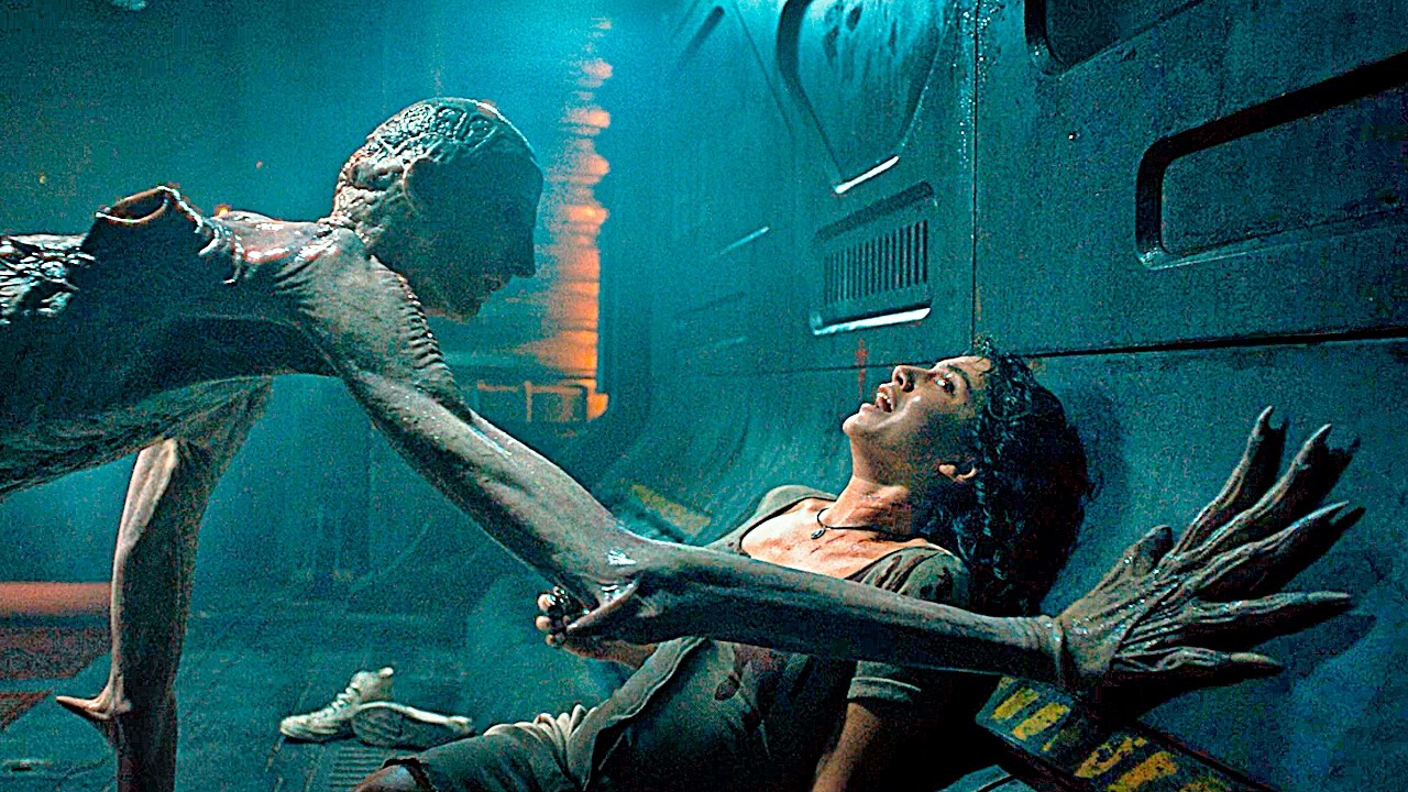 A terrifying scene from Alien: Romulus shows the Offspringâa grotesque xenomorph-human hybridâpinning a woman against a wall, its clawed hand stretched across her chest.