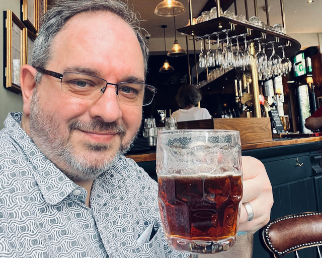 Magnus having a pint of bitters in a London pub